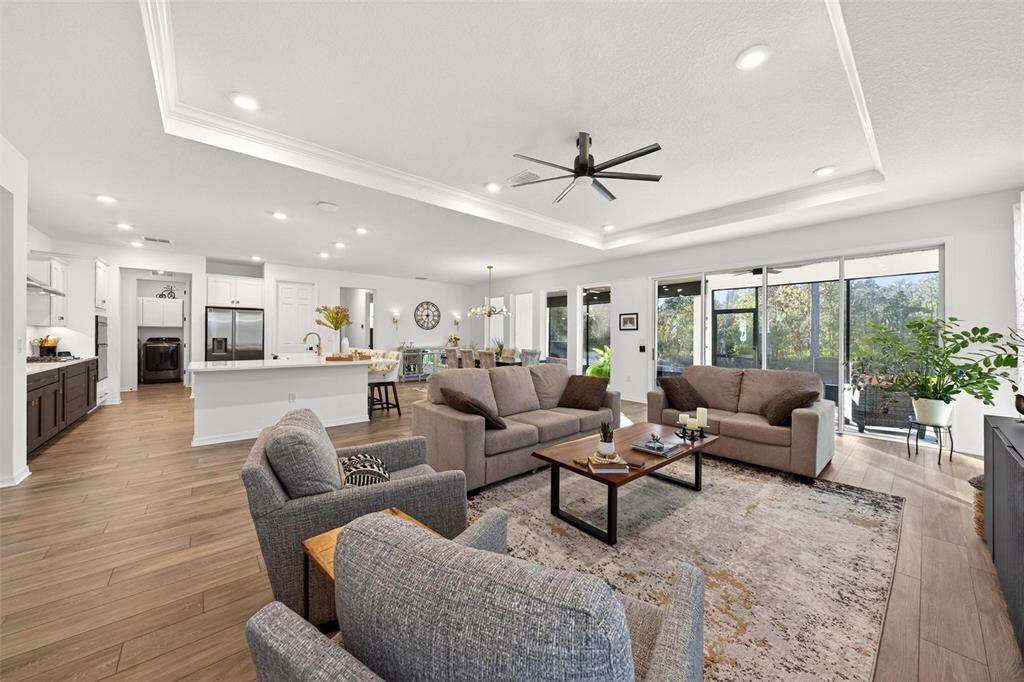 9746 Southwest 108th Terrace Road Ocala, FL 34481 - Photo 19 of 99 a living room with furniture and a large window