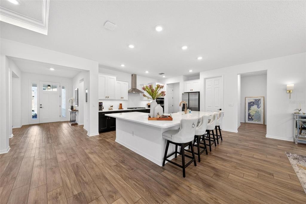 9746 Southwest 108th Terrace Road Ocala, FL 34481 - Photo 21 of 99 a view of a dining room with furniture and wooden floor