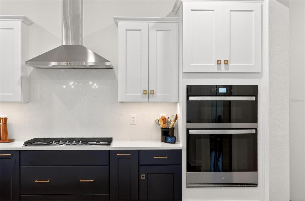 9746 Southwest 108th Terrace Road Ocala, FL 34481 - Photo 27 of 99 a kitchen with a stove and white cabinets