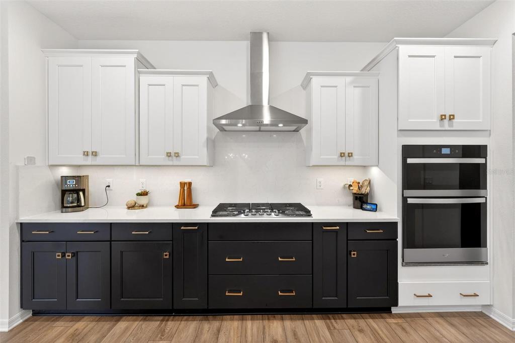 9746 Southwest 108th Terrace Road Ocala, FL 34481 - Photo 28 of 99 a kitchen with stainless steel appliances granite countertop a refrigerator and a stove top oven