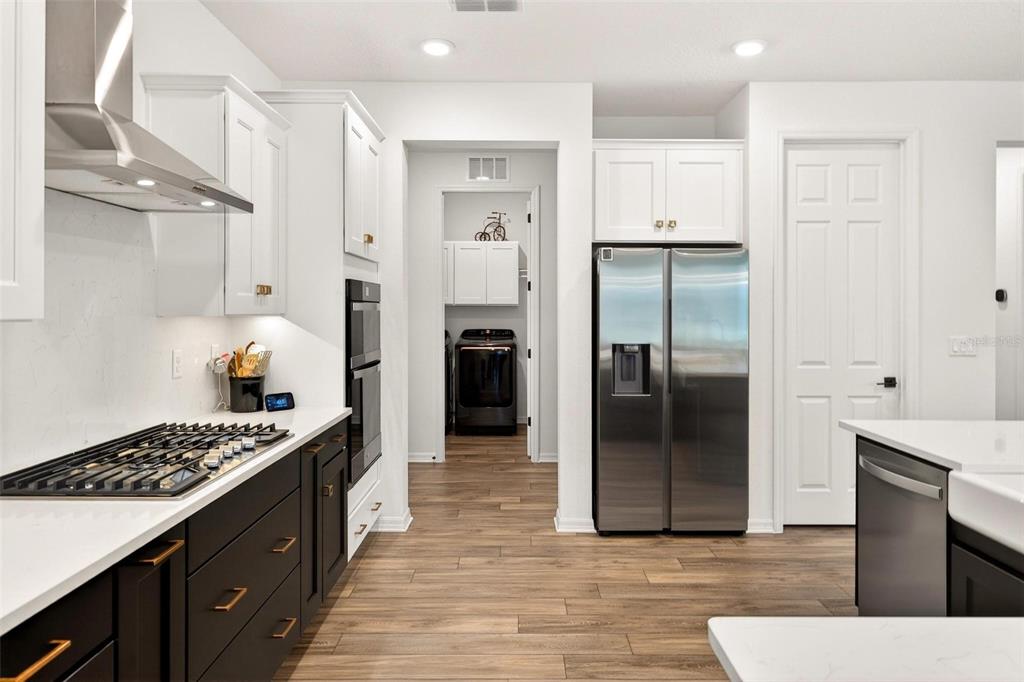 9746 Southwest 108th Terrace Road Ocala, FL 34481 - Photo 33 of 99 a kitchen with stainless steel appliances granite countertop a refrigerator and a stove top oven