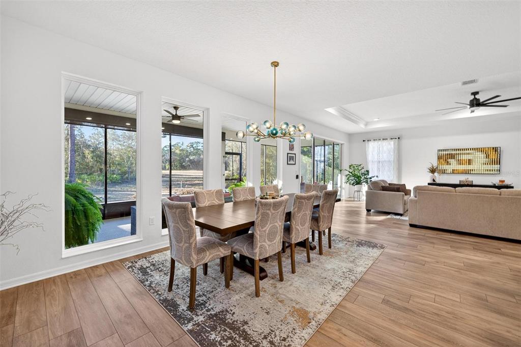 9746 Southwest 108th Terrace Road Ocala, FL 34481 - Photo 37 of 99 a view of a dining room with furniture window and wooden floor