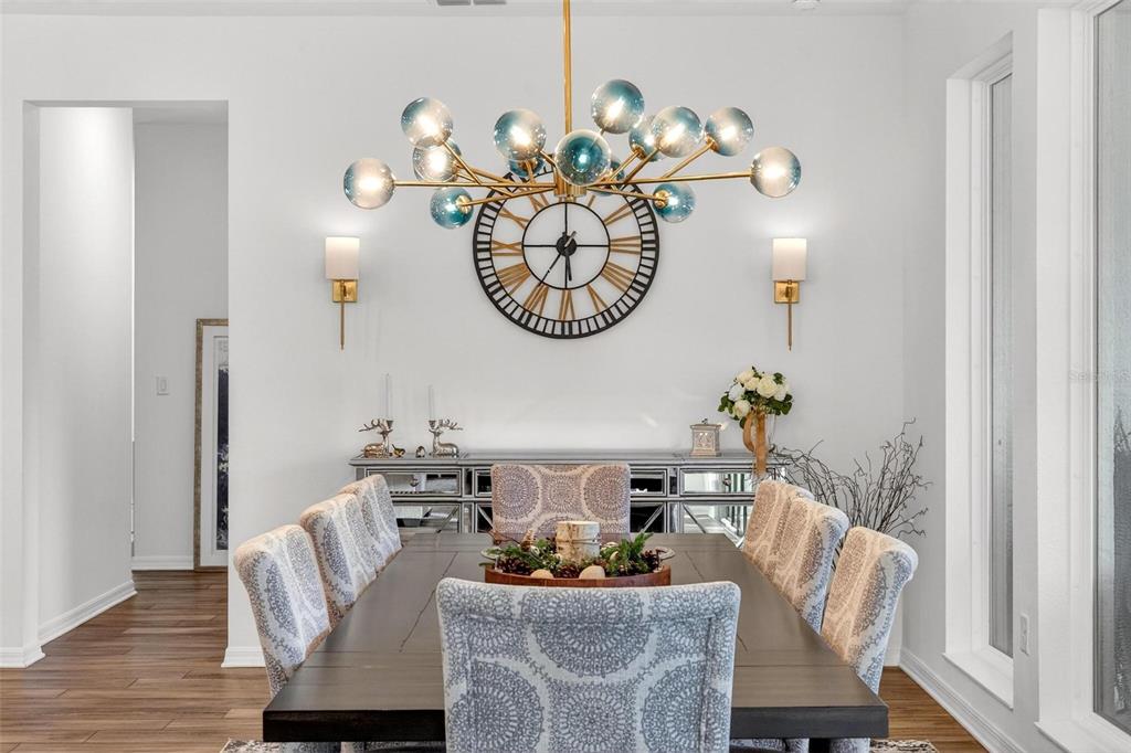 9746 Southwest 108th Terrace Road Ocala, FL 34481 - Photo 41 of 99 a dining room with furniture and wooden floor