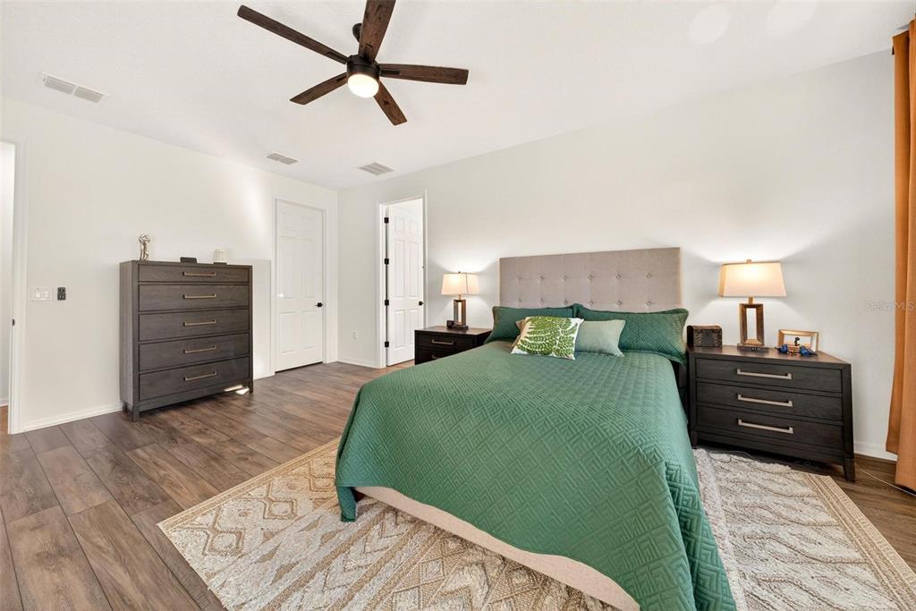 9746 Southwest 108th Terrace Road Ocala, FL 34481 - Photo 45 of 99 a bedroom with a bed and a dresser