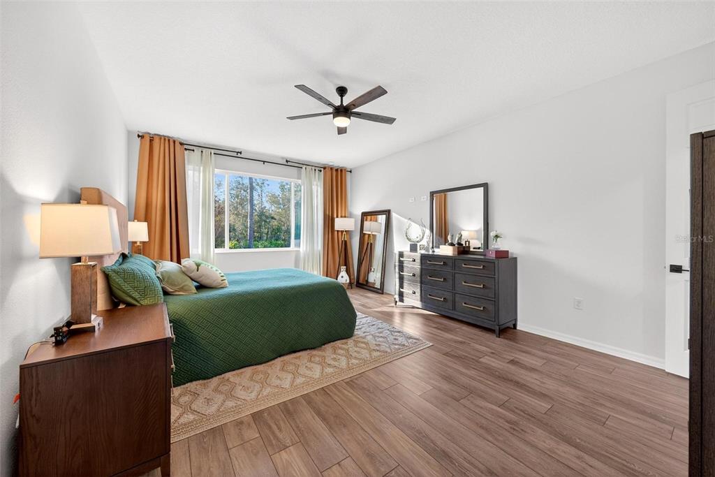 9746 Southwest 108th Terrace Road Ocala, FL 34481 - Photo 49 of 99 a living room with furniture window and wooden floor