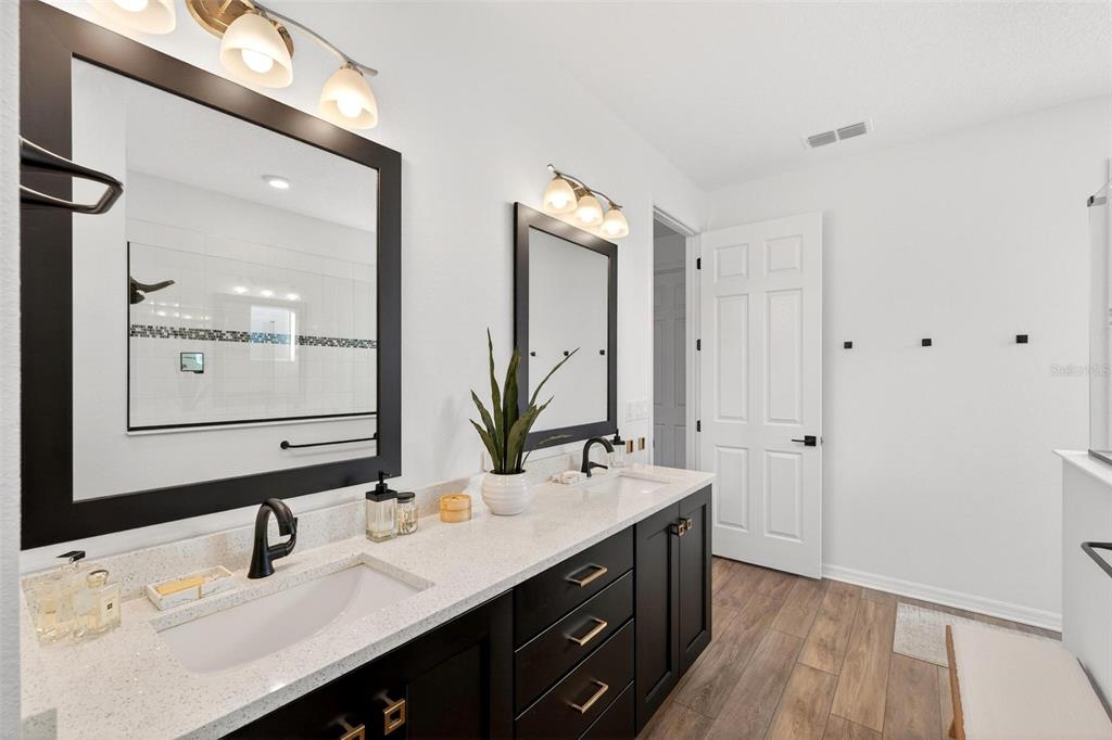 9746 Southwest 108th Terrace Road Ocala, FL 34481 - Photo 56 of 99 a bathroom with a double vanity sink mirror and