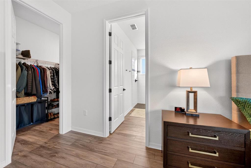9746 Southwest 108th Terrace Road Ocala, FL 34481 - Photo 60 of 99 a view of a workspace room with wooden floor cabinet and window
