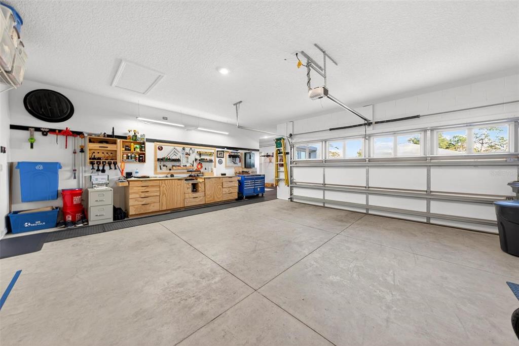 9746 Southwest 108th Terrace Road Ocala, FL 34481 - Photo 79 of 99 a view of a garage with furniture and a kitchen
