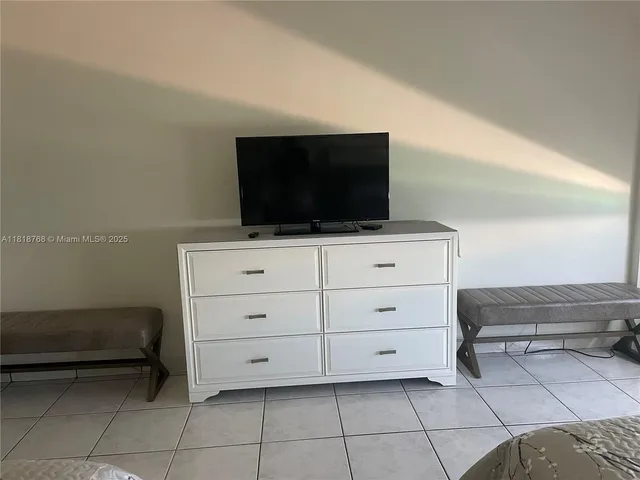 a kitchen with stainless steel appliances a stove sink and cabinets