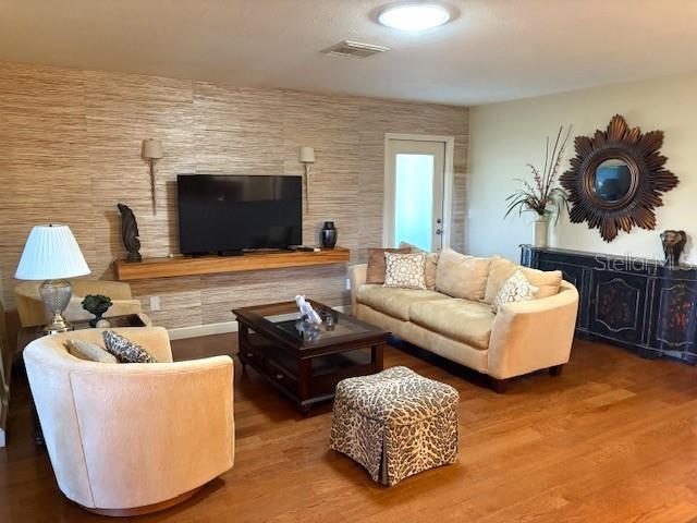 404 Feltham Trail, Unit B Sun City Center, FL 33573 - Photo 12 of 59 a living room with furniture and a flat screen tv