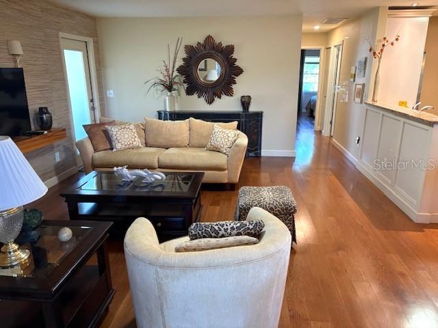 404 Feltham Trail, Unit B Sun City Center, FL 33573 - Photo 13 of 59 a living room with furniture and a fireplace