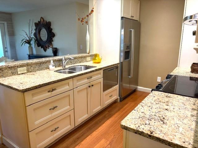 404 Feltham Trail, Unit B Sun City Center, FL 33573 - Photo 18 of 59 a bathroom with a granite countertop sink and a mirror