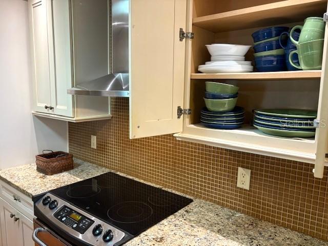 404 Feltham Trail, Unit B Sun City Center, FL 33573 - Photo 24 of 59 a kitchen with a stove and a sink