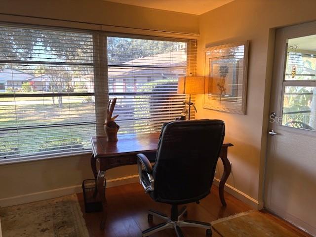 404 Feltham Trail, Unit B Sun City Center, FL 33573 - Photo 26 of 59 a view of a workspace with furniture and a window