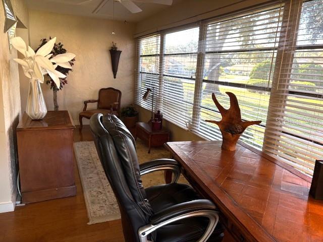 404 Feltham Trail, Unit B Sun City Center, FL 33573 - Photo 28 of 59 a view of a living room with furniture and a window
