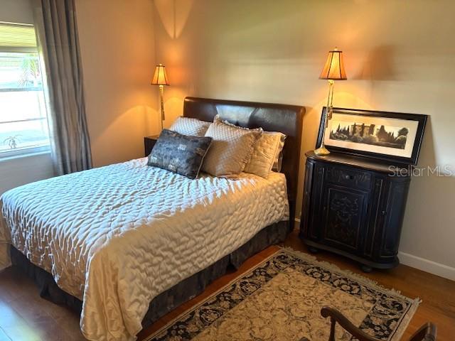 404 Feltham Trail, Unit B Sun City Center, FL 33573 - Photo 31 of 59 a bedroom with a bed and a window