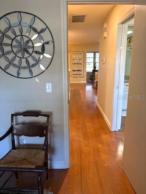 404 Feltham Trail, Unit B Sun City Center, FL 33573 - Photo 36 of 59 a view of a livingroom with furniture and a hallway