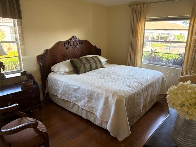 404 Feltham Trail, Unit B Sun City Center, FL 33573 - Photo 38 of 59 a bed sitting in a bedroom next to a window