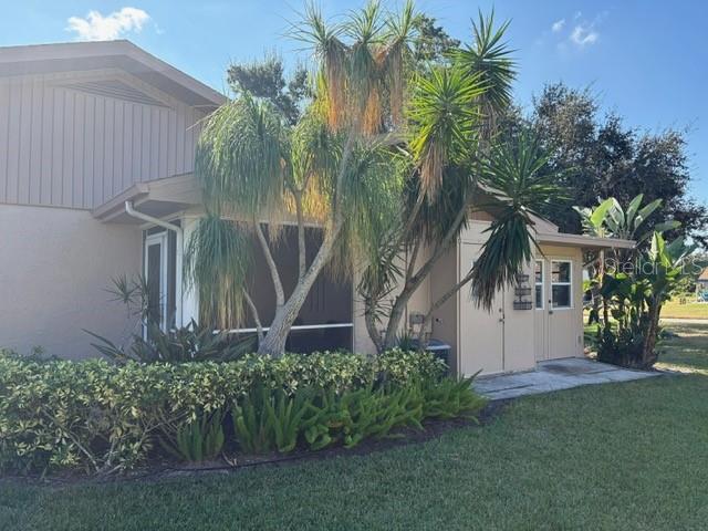 404 Feltham Trail, Unit B Sun City Center, FL 33573 - Photo 4 of 59 a view of house with palm trees