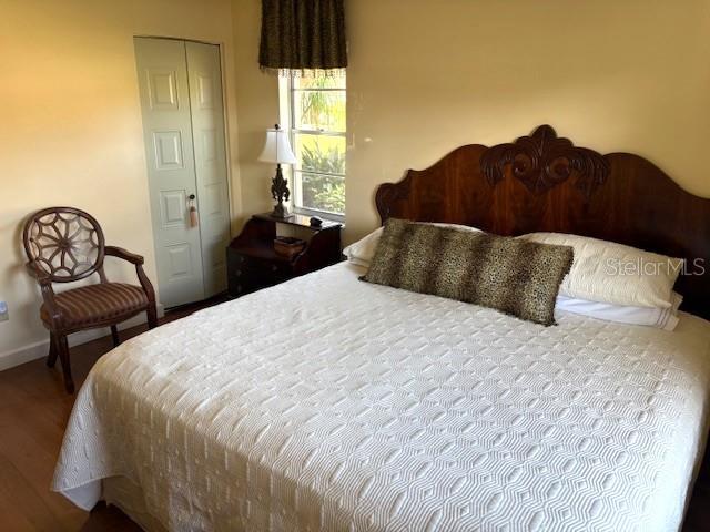 404 Feltham Trail, Unit B Sun City Center, FL 33573 - Photo 41 of 59 a large bed sitting in a bedroom next to a window