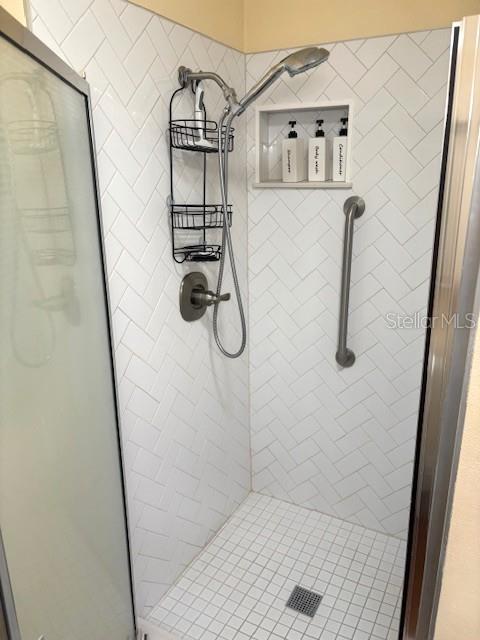 404 Feltham Trail, Unit B Sun City Center, FL 33573 - Photo 45 of 59 a bathroom with a shower