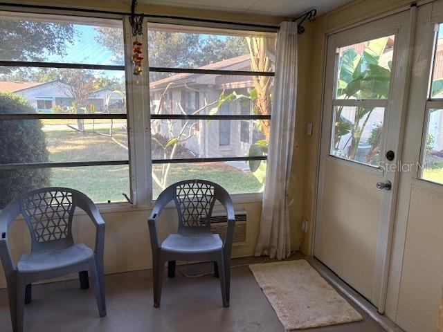 404 Feltham Trail, Unit B Sun City Center, FL 33573 - Photo 47 of 59 a room with furniture and a window