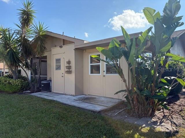 404 Feltham Trail, Unit B Sun City Center, FL 33573 - Photo 6 of 59 a front view of a house with a yard