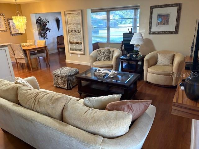 404 Feltham Trail, Unit B Sun City Center, FL 33573 - Photo 9 of 59 a living room with furniture fireplace and a window