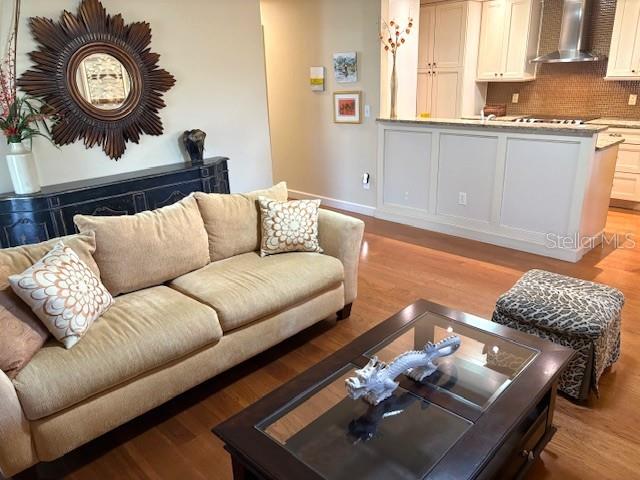 404 Feltham Trail, Unit B Sun City Center, FL 33573 - Photo 10 of 59 a living room with furniture and a window