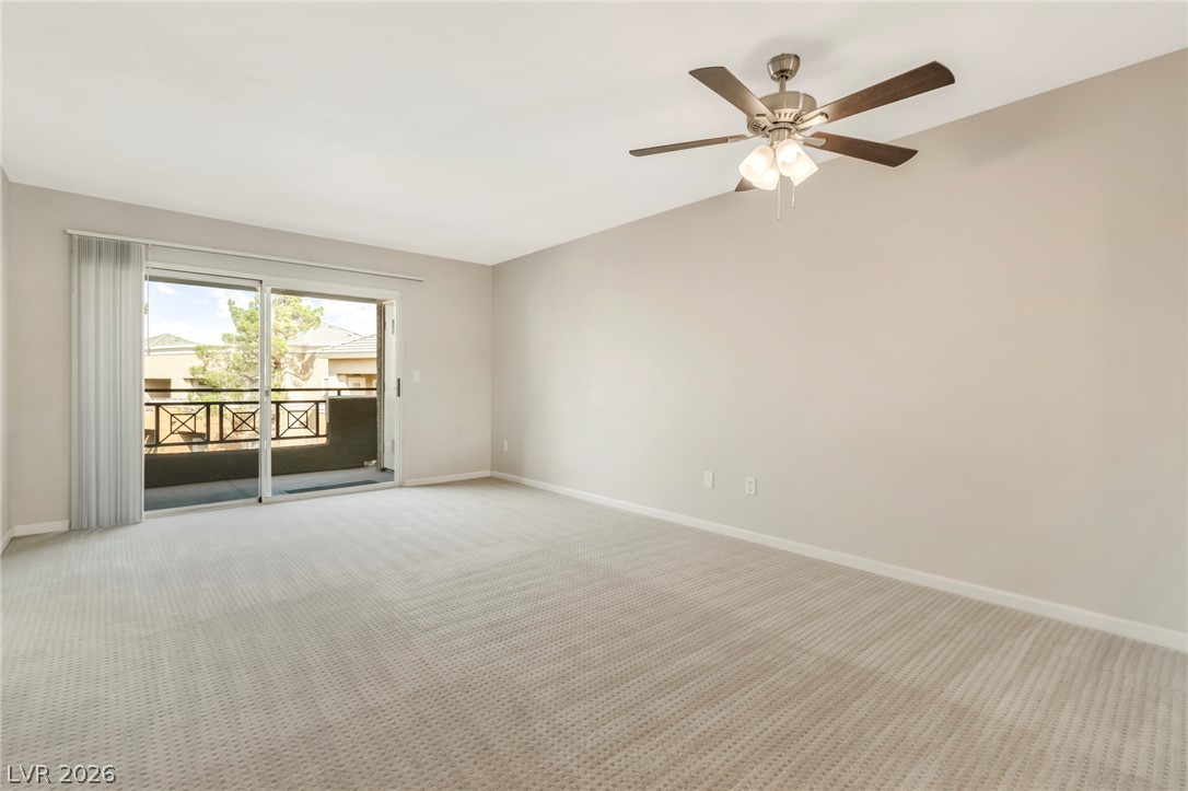 8070 West Russell Road, Unit 2006 Las Vegas, NV 89113 - Photo 8 of 24 A spacious room with a private balcony, perfect for serene mornings or evening relaxation.