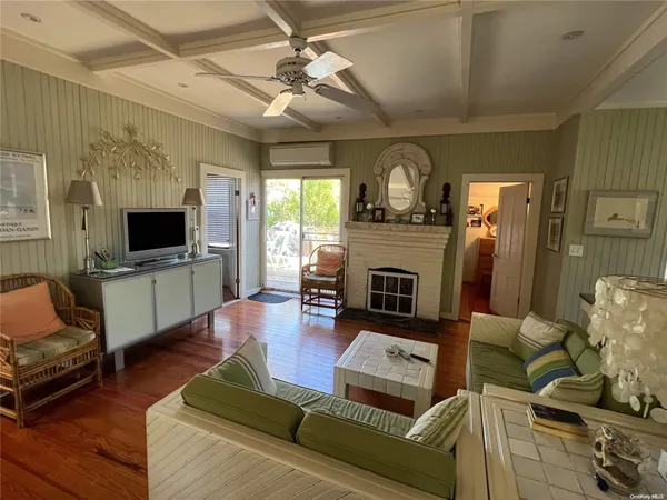 a living room with furniture fireplace and flat screen tv