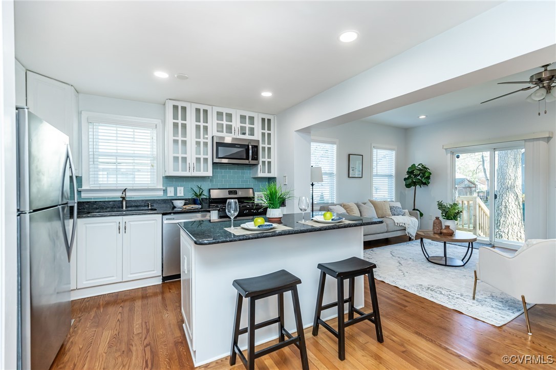 1021 Orchard Road Richmond, VA 23226 - Photo 7 of 22 Classic white kitchen with S/S appliances and gas