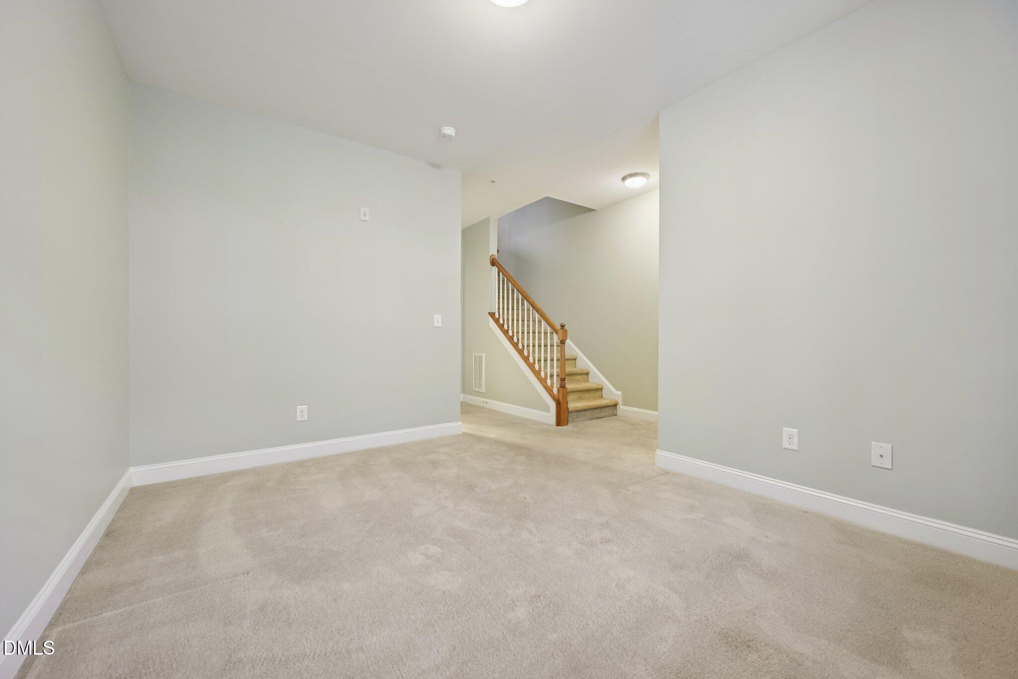 10510 Sablewood Drive, Unit 113 Raleigh, NC 27617 - Photo 34 of 38 a view of an empty room with stairs