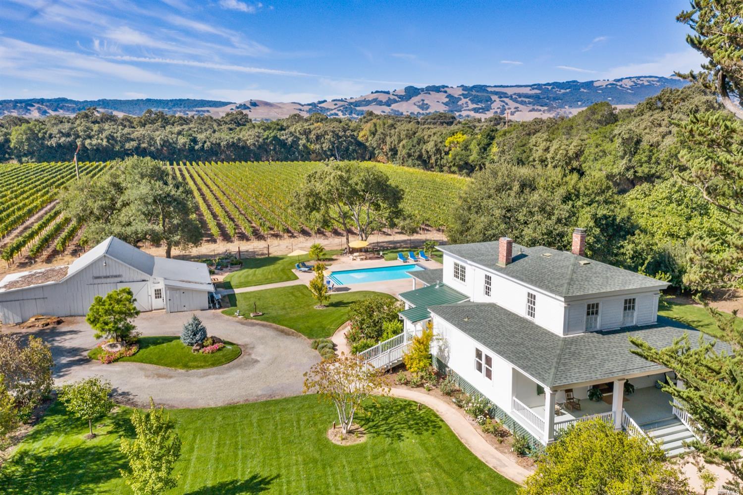 an aerial view of a house with a ocean view