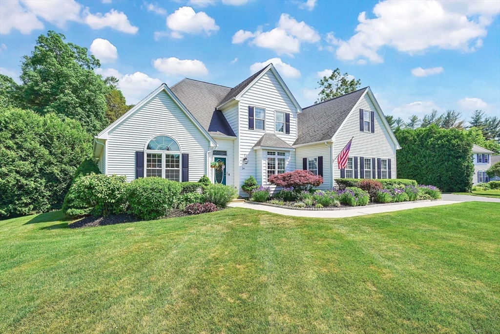 24 Two Ponds Road Belchertown, MA 01007 - Photo 1 of 41 a front view of a house with a garden and yard