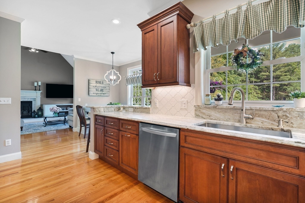 24 Two Ponds Road Belchertown, MA 01007 - Photo 14 of 41 a kitchen with stainless steel appliances granite countertop a sink counter space and a view of living room