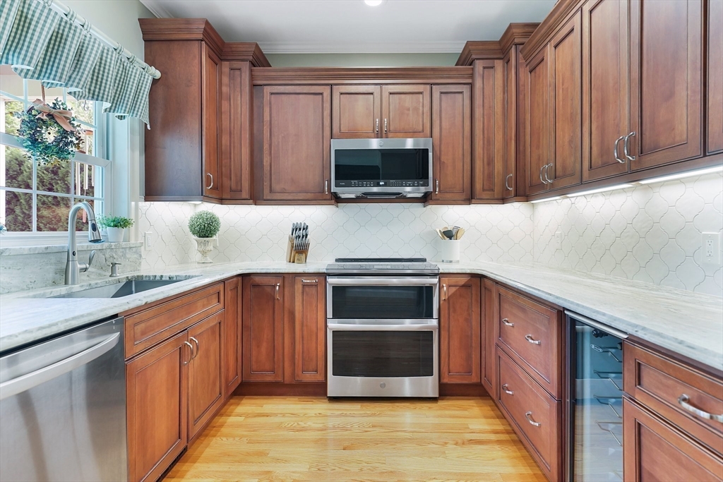 24 Two Ponds Road Belchertown, MA 01007 - Photo 16 of 41 a kitchen with stainless steel appliances a stove a sink and a microwave