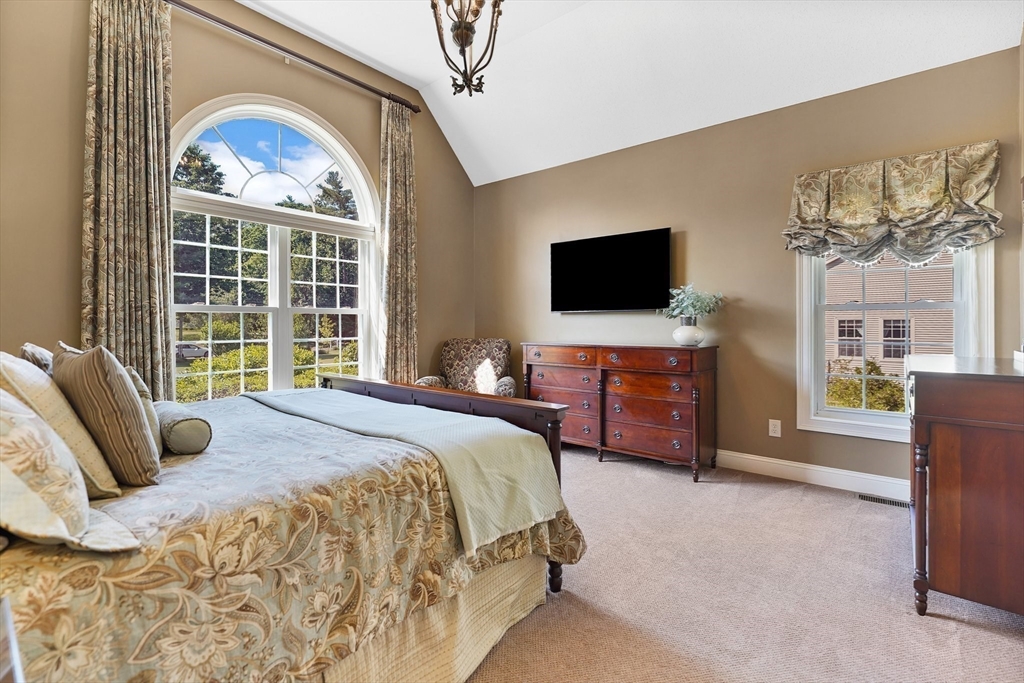 24 Two Ponds Road Belchertown, MA 01007 - Photo 18 of 41 a bedroom with a bed and a flat screen tv