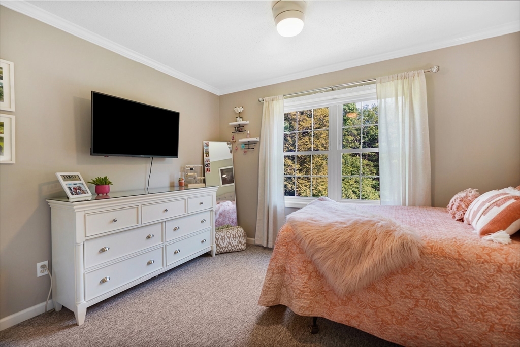 24 Two Ponds Road Belchertown, MA 01007 - Photo 25 of 41 a bedroom with a bed and a flat screen tv