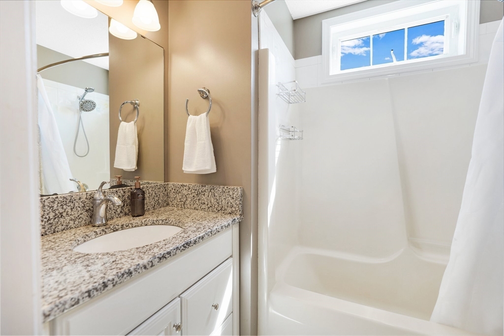 24 Two Ponds Road Belchertown, MA 01007 - Photo 27 of 41 a bathroom with a granite countertop sink and a mirror