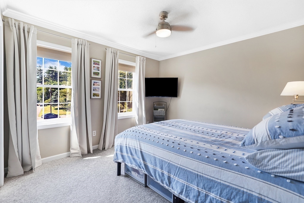 24 Two Ponds Road Belchertown, MA 01007 - Photo 31 of 41 a bedroom with a bed and a flat screen tv