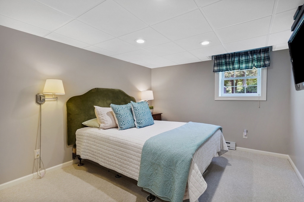 24 Two Ponds Road Belchertown, MA 01007 - Photo 32 of 41 a bedroom with a bed and a night stand