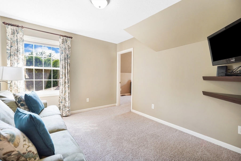 24 Two Ponds Road Belchertown, MA 01007 - Photo 34 of 41 a living room with furniture and a flat screen tv