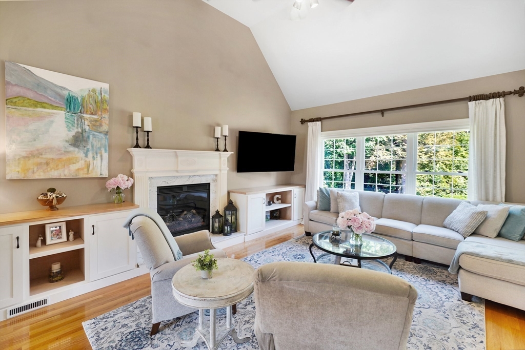 24 Two Ponds Road Belchertown, MA 01007 - Photo 10 of 41 a living room with furniture a fireplace and a flat screen tv