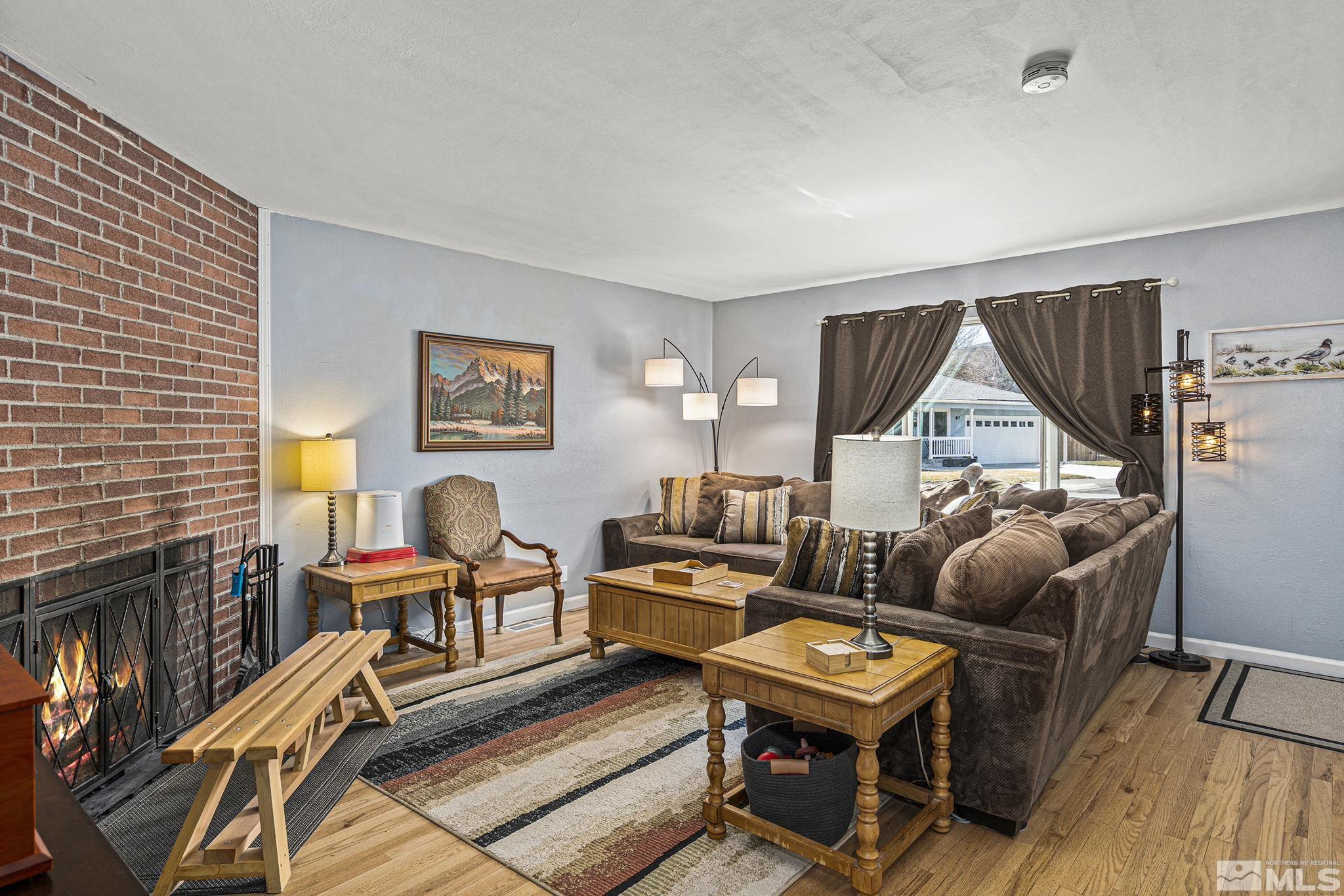 20 Kaye Way Reno, NV 89509 - Photo 3 of 17 a living room with furniture and a wooden floor