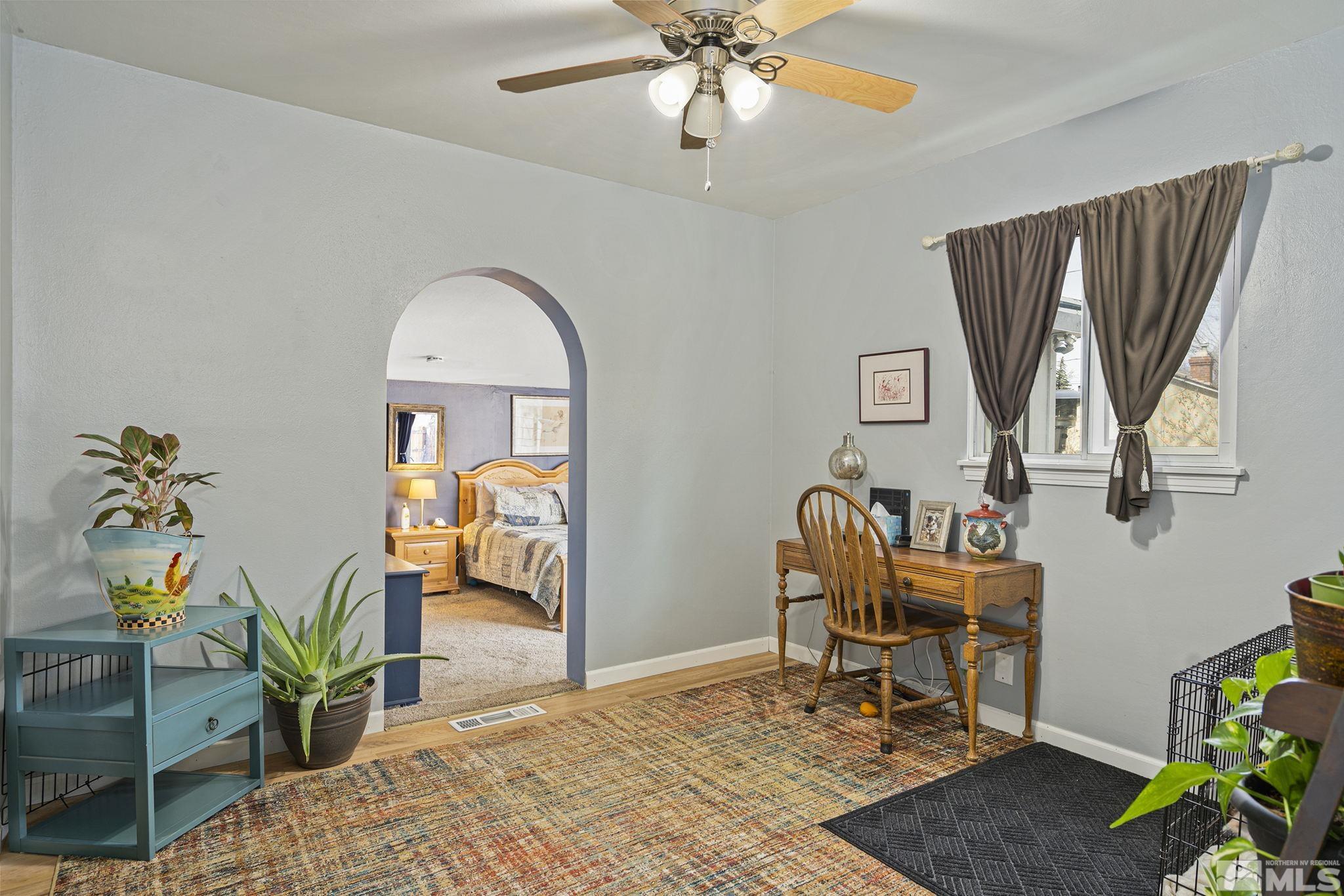 20 Kaye Way Reno, NV 89509 - Photo 6 of 17 a work room with furniture and a potted plant