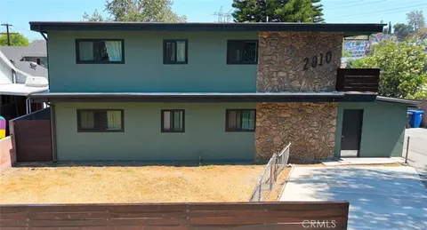 a front view of a house with yard
