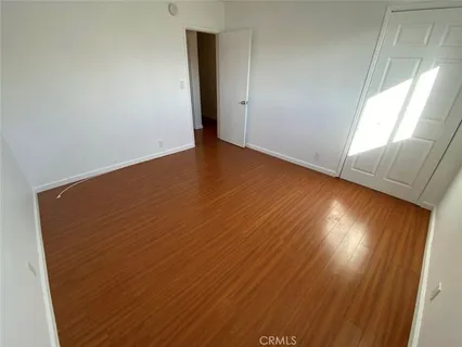 an empty room with wooden floor