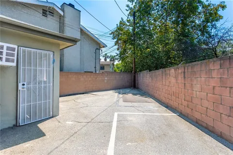 a view of a house with entertaining space in front of it