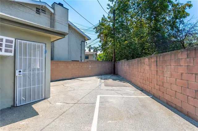 a view of a house with entertaining space in front of it